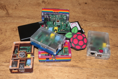 Collection of Raspberry Pis - cases from Pimoroni, ModMyPi and Cyntech