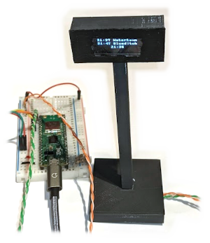 Model railway departure board with OLED display controlled by a Raspberry Pi Pico W