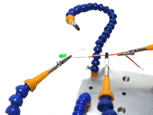 3rd hand used for soldering electronic components - LED